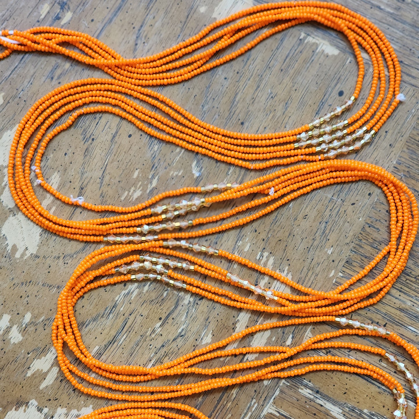 Orange Premium handmade waistbeads with orange iridescent crystals